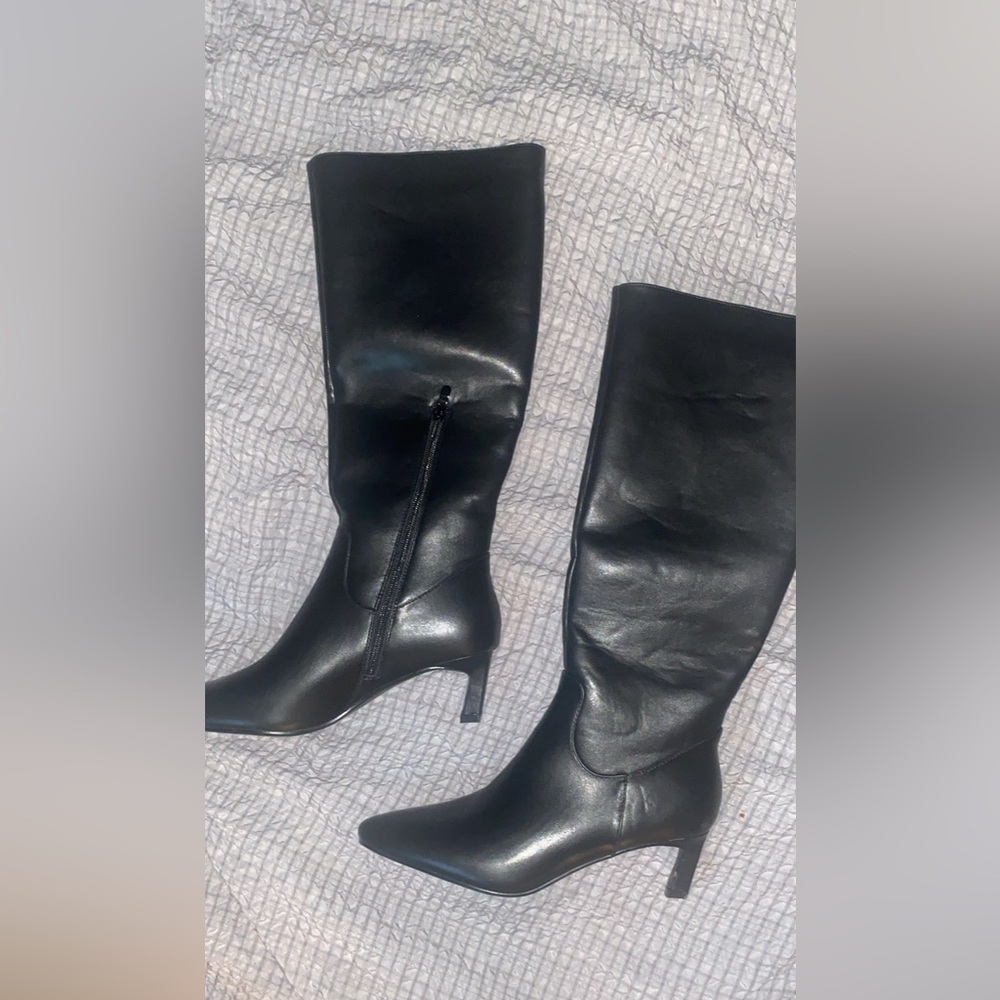 All black knee high pointed toe black boots with kitten heel